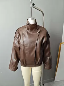 Oversized brown faux leather jacket on mannequin featuring high neck and asymmetric design.