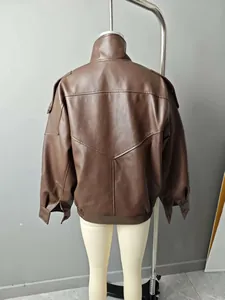 Detailed back view of a loose brown faux leather jacket for women with V-shaped stitching