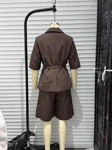 Detailed back view of a brown five-quarter sleeve blazer and shorts set on a mannequin