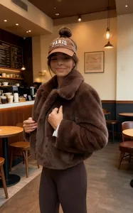 Chic brown faux fur short jacket with lapel collar for autumn and winter street style warmth.