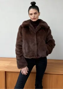 Stylish short brown faux fur jacket with wide lapel collar for warm winter fashion.