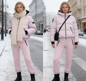Fashionable pink ski puffer jacket and pants set for winter outdoor activities