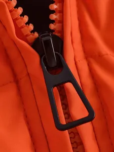 Close-up of a high-quality black metal zipper pull on an orange winter puffer coat