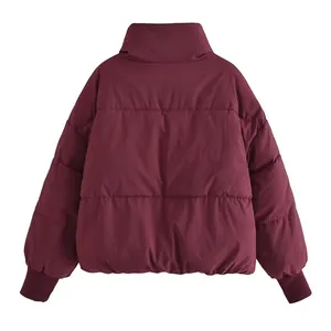 Back view of a cozy oversized burgundy quilted puffer jacket for women in winter