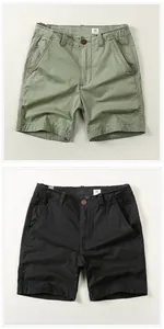 Close-up detail of American vintage men's cotton shorts in olive green and black