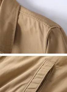 Gros plan du tissu en sergé de coton kaki et du détail de la poche d'une veste de travail