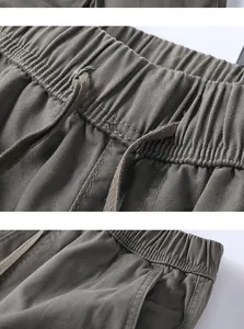 Close-up detail of vintage men's cargo shorts with elastic drawstring waistband.