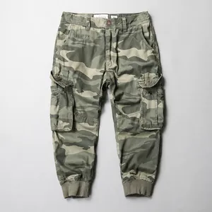 Men's rugged camouflage cargo cropped pants featuring a relaxed fit and zipper fly
