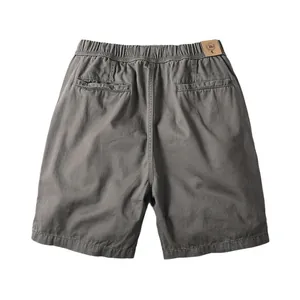 Men's retro casual cotton shorts in greyish khaki, back view featuring elastic waistband.