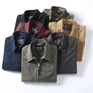 Group of folded men's vintage cargo jackets in various colors and camo patterns