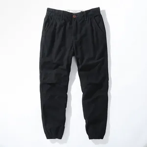 Vintage black cotton cargo joggers for men featuring elastic cuffs and relaxed fit design