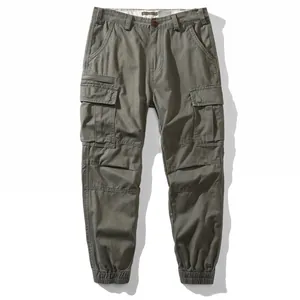 Vintage men's cargo joggers with large side pockets and loose fit in olive green.