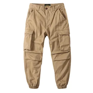 Vintage khaki men's loose cargo jogger pants featuring side pockets and elastic ankle cuffs
