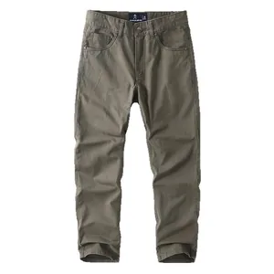 Vintage military green cotton work pants for men in a relaxed loose straight cut design