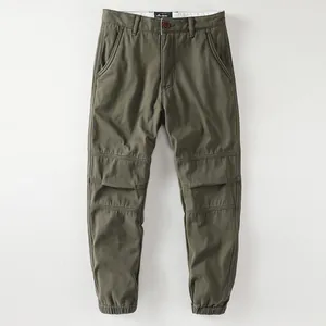 Men's retro olive green fleece-lined cargo joggers with pleated knee details
