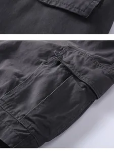 Detailed macro shot showing the cargo pocket and stitching on dark grey cotton shorts