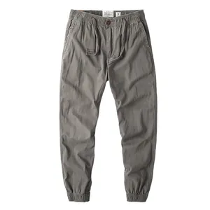 Vintage grey cotton cargo pants for men with drawstring waist and elastic cuffs