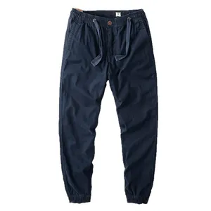 Pantaloni cargo vintage blu navy da uomo con coulisse elastica e polsini a costine.