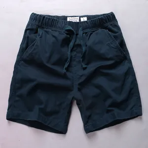 Men's navy blue cotton casual shorts featuring an elastic waistband and drawstring detail