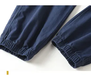 Detailed macro shot of elasticated cuffs on heavy navy blue men's cargo jogging pants