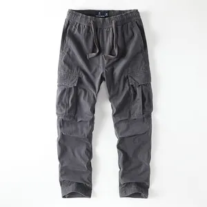 Vintage men's cargo pants in dark grey featuring multi-pockets and drawstring waist