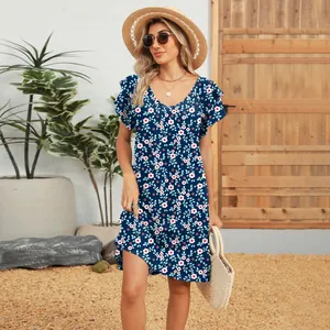 Detail view of navy blue floral V-neck dress with elegant double flutter sleeves