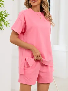 Pink two-piece loungewear set with side slit crew neck T-shirt and matching shorts