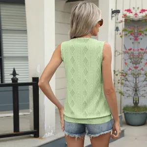 Back view of light green sleeveless jacquard knit vest top with textured diamond pattern.