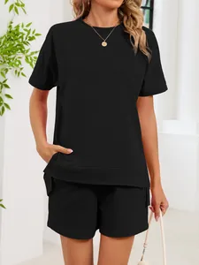Close-up of women's black loungewear set with crew neck t-shirt and pocket shorts.