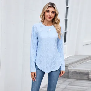 Casual light blue long sleeve knit top with curved hem and textured diamond pattern