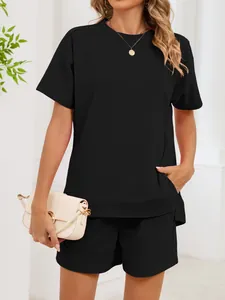 Detailed view showing the loose fit black crew neck t-shirt and shorts set for women