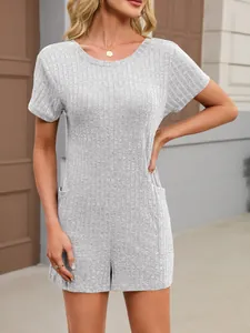 Detailed macro view of a gray rib-knit short sleeve romper featuring side pockets