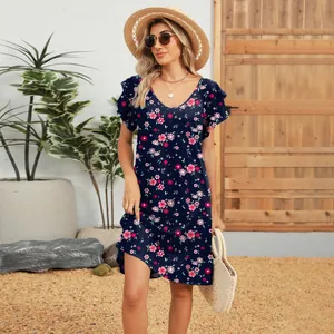 Close-up showing the floral print and ruffle sleeve detail of this summer V-neck dress.