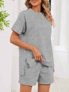Two-piece gray loungewear set featuring loose t-shirt with side slits and shorts
