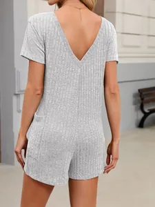 Detail view of the back of a grey ribbed V-neck short sleeve romper with pockets.
