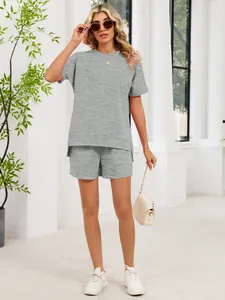 Full-length view of the grey lounge set showing the side slit detail and fit on a model