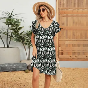 Detailed view of the V-neck floral dress with double ruffle sleeves on a model.