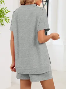 Back view of women's casual grey two-piece set featuring side slit top and shorts