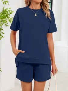 Detail shot of navy blue women's loungewear set featuring a round neck top and shorts.