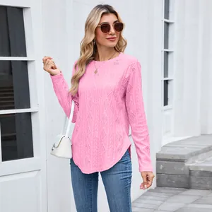 Close-up of pink long-sleeved top with hollow-out diamond pattern