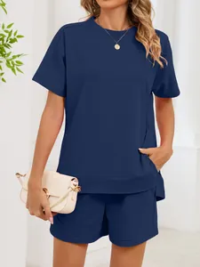Detailed view of women's navy blue two-piece short sleeve top and shorts lounge set.