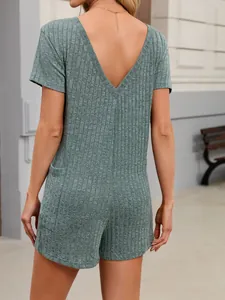 Back view of a green ribbed loose V-neck short-sleeved jumpsuit with pockets for women