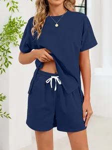 Detail of women's navy blue lounge set showing top slit and drawstring shorts