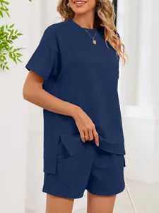 Detail view of navy blue round neck t-shirt and matching shorts set with side slits