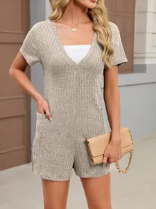 Detailed close-up of a beige ribbed V-neck short sleeve romper featuring functional side pockets
