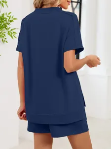 Back view of women's navy blue two-piece set featuring loose t-shirt and shorts