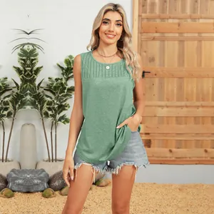 Close-up of green round neck sleeveless pleated top styled with denim shorts