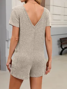 Detailed back view of a grey ribbed short sleeve V-neck romper with functional pockets