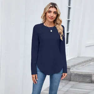 Detail view of women's navy blue long sleeve knit top with hollow pattern and curved hem