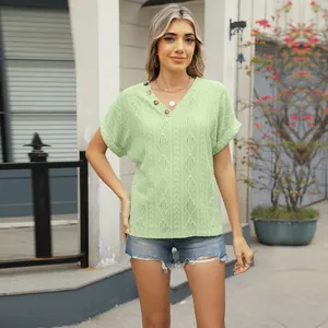 Elegant light green V-neck jacquard short sleeve top with buttons for a chic summer look.